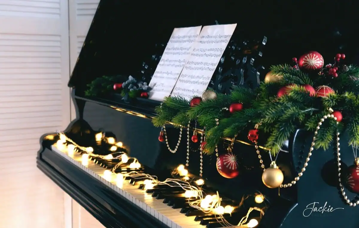 soundtrack-december closeup of a piano keyboard, decorated for Christmas holiday, music on the stand